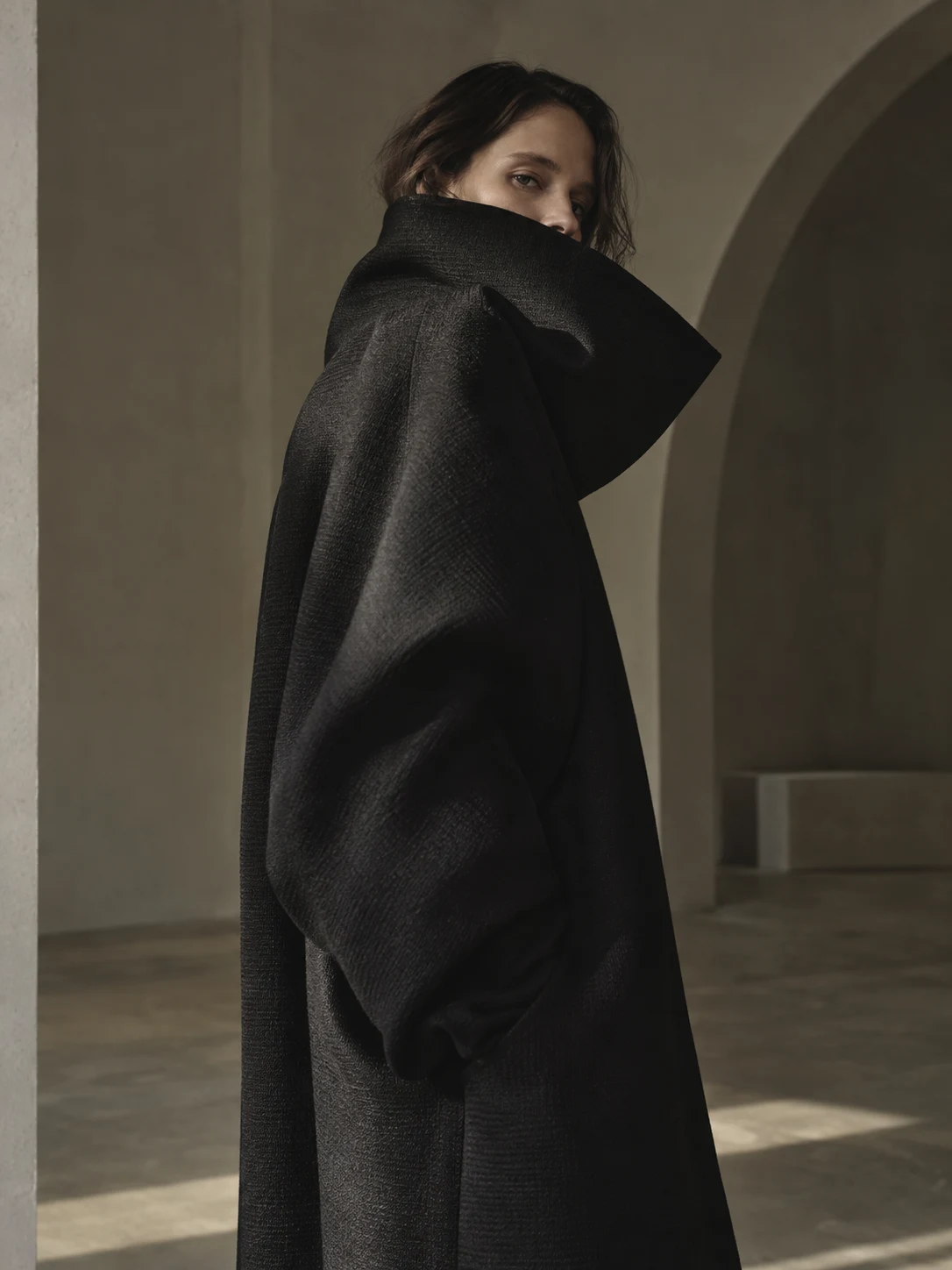 A study of the space between a person and the shape they inhabit. Sculptural clothing, quiet architecture, and light that leaves room for ambiguity.