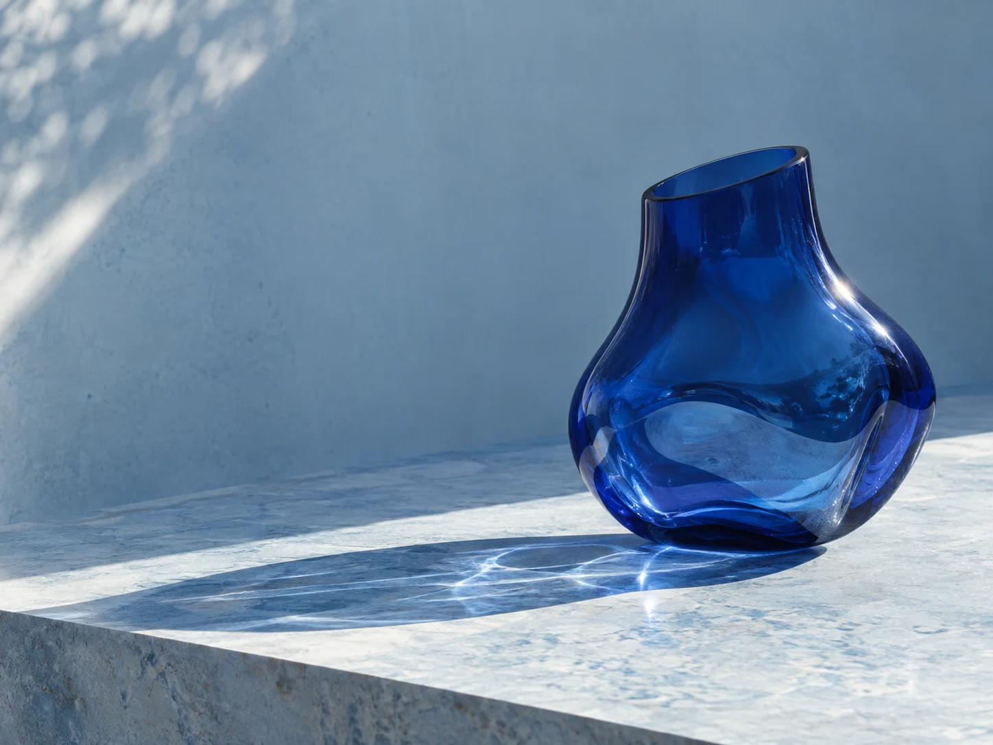 A cobalt object, an ordinary afternoon, and a small experiment in seeing. A still-life study of refraction, surface, and the shadow an object leaves behind.