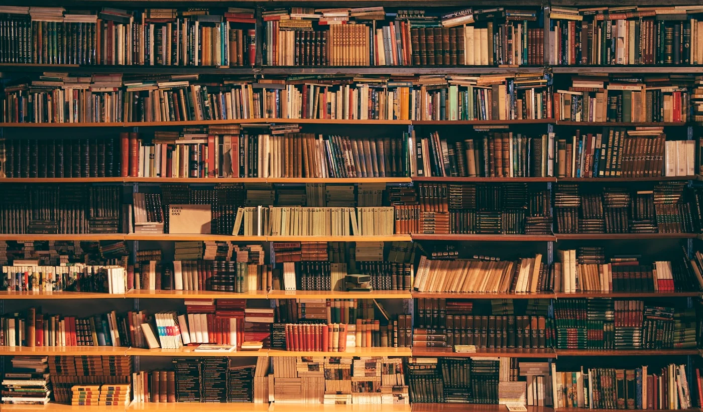 Tall shelves filled with books in a library