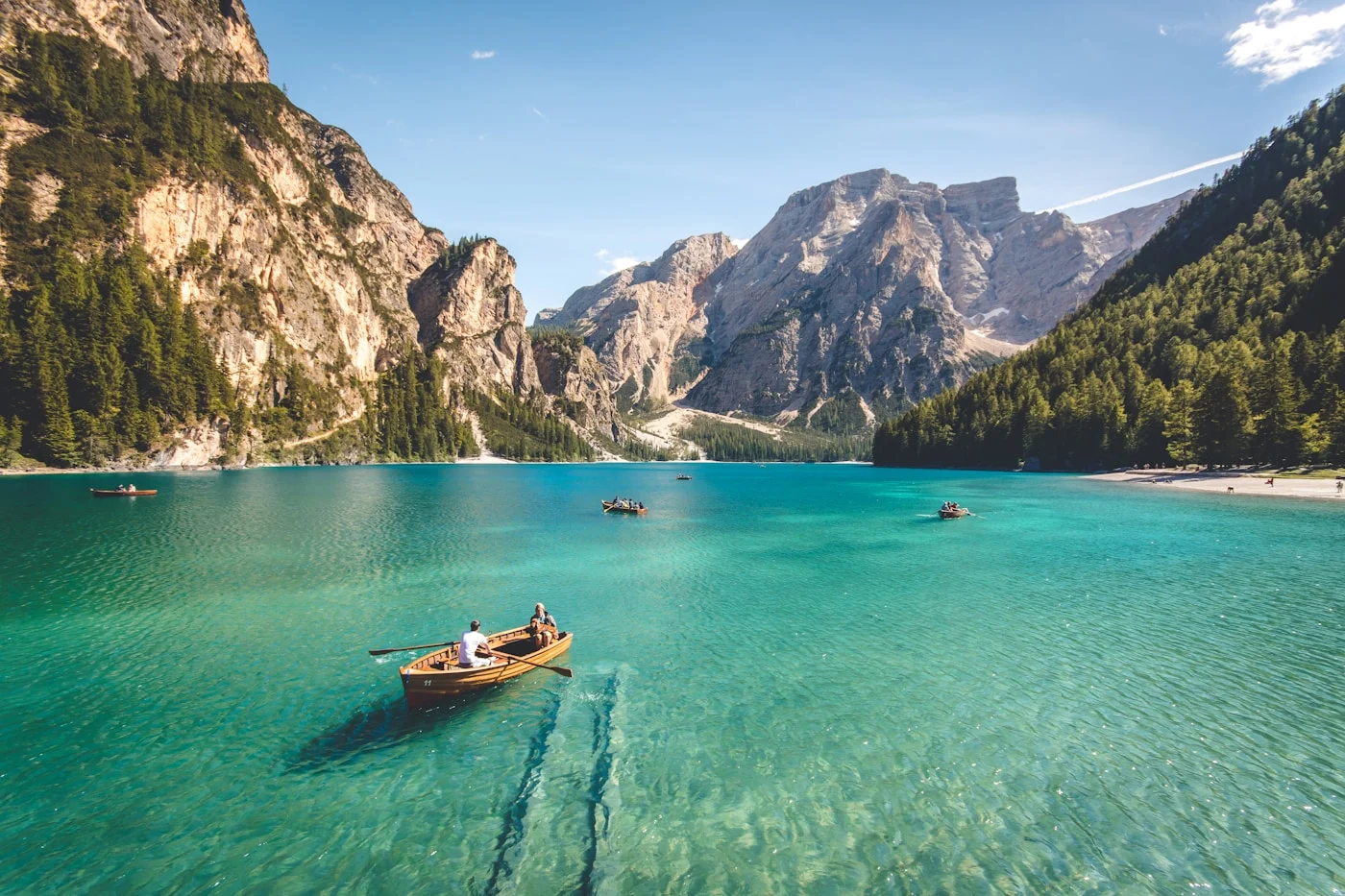 A wide mountain lake beneath a pale sky